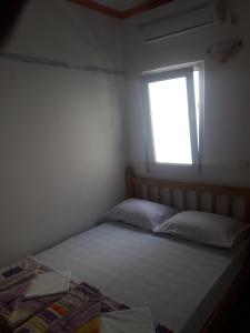 Postel nebo postele na pokoji v ubytování Apartmani Bugarski