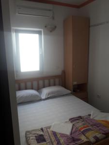Postel nebo postele na pokoji v ubytování Apartmani Bugarski
