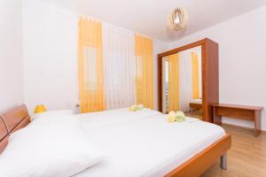 Posteľ alebo postele v izbe v ubytovaní Apartman Domić