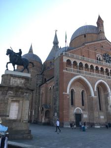a large building with a statue in front of it at Ciao Amore in Padova
