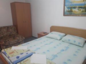 Postel nebo postele na pokoji v ubytování Apartmani Bugarski