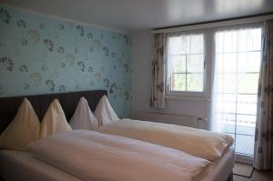 Letto o letti in una camera di Hotel Frohe Aussicht