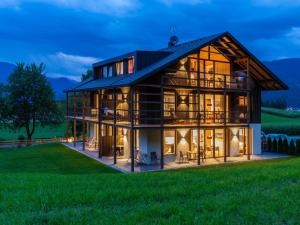 a large house with a gambrel roof at Kronplatz CHALET WALCHHORN Brunico Dolomites in Brunico