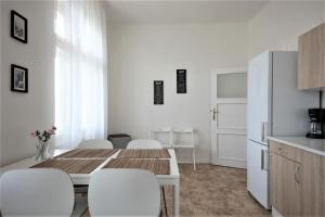 Kuchyň nebo kuchyňský kout v ubytování Angel City Aparthotel