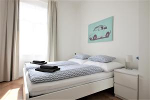 Postel nebo postele na pokoji v ubytování Angel City Aparthotel