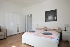 Postel nebo postele na pokoji v ubytování Angel City Aparthotel