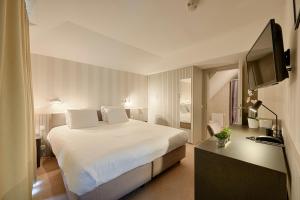 Postel nebo postele na pokoji v ubytování Hotel 't Putje