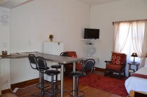 a kitchen with a table and chairs in a room at Villelodge Accommodation in Lüderitz