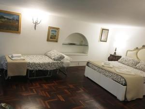 A bed or beds in a room at Foro Romano Apartments A