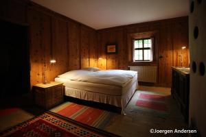 A bed or beds in a room at Piburg Seebichlhof