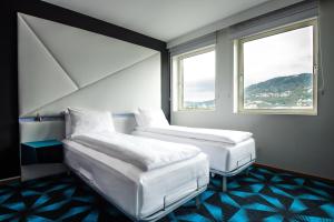 En eller flere senger på et rom på Magic Hotel Solheimsviken