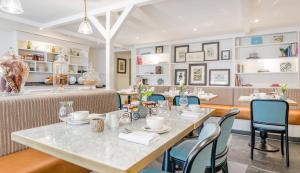 a dining room with a table and chairs at Didsbury House Hotel in Manchester