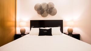 Ένα ή περισσότερα κρεβάτια σε δωμάτιο στο Bugalha My Loft Douro 3