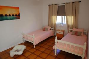 a room with two beds and a window at Casa Miramar in Gran Tarajal