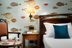 
Ein Bett oder Betten in einem Zimmer der Unterkunft Hotel Continental Genova
