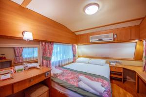 a small room with a bed and a desk at S3 Seahorse Beach Club in Oludeniz