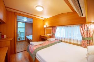 a small room with a bed and a window at S3 Seahorse Beach Club in Oludeniz