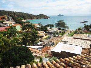 a view of a town and the ocean at Casagrande Hotel Boutique in Búzios