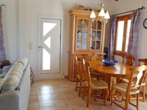a dining room with a wooden table and chairs at Holiday Home Gabi by Interhome in Monte Pego