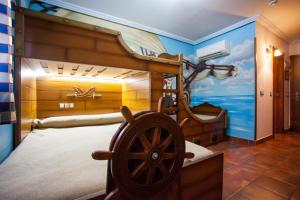 a bedroom with a large bed with a boat mural at El Volante in Ciempozuelos +95 photos