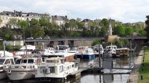 a bunch of boats are docked in a marina at Les Lamartine-chambres d'hôtes in Le Mans
