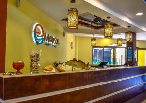 a restaurant with a fish on top of a counter at Mar & Sol, Hotel y resturante in La Unión