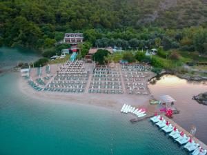 an aerial view of a beach with chairs and umbrellas at S3 Seahorse Beach Club in Oludeniz
