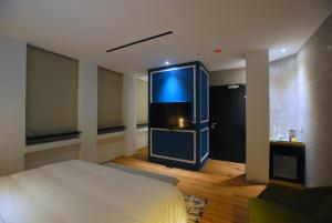 Postel nebo postele na pokoji v ubytování 小小邸 Small Hotel