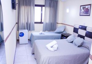 Ένα ή περισσότερα κρεβάτια σε δωμάτιο στο San Remo City Hotel +56 φωτογραφίες