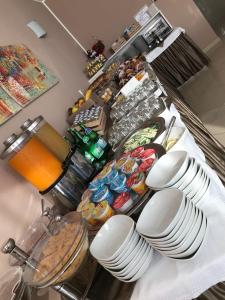 a kitchen counter with plates and other food on it at Bikini Hotel in Vieste