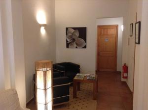 Posezení v ubytování Hotel Es Mercadal