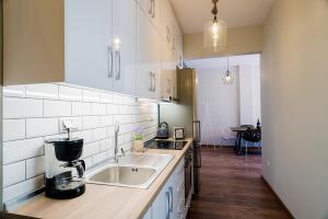 Η κουζίνα ή μικρή κουζίνα στο Homesweethome Apartments