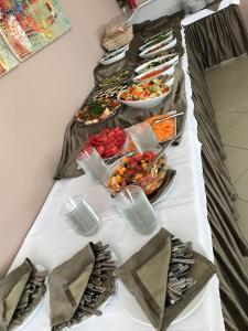 a buffet table with several plates of food on it at Bikini Hotel in Vieste