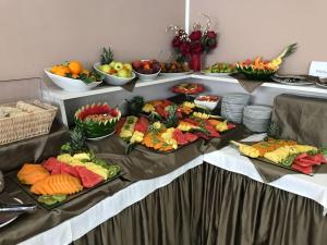 a table with many different types of fruit on it at Bikini Hotel in Vieste