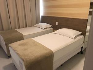 En eller flere senge i et værelse på Apartamento Beach Class Eco Life + 49 billeder