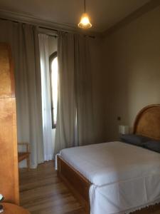 Ліжко або ліжка в номері Castello Mellana