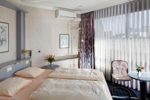 Postel nebo postele na pokoji v ubytování Hotel Senator Hamburg + 17 fotografií