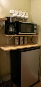 a microwave sitting on top of a kitchen counter at Winter Park charm in Orlando