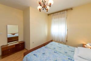 Postel nebo postele na pokoji v ubytování Apartment Lele