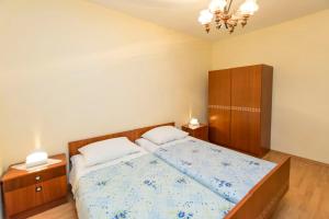 Postel nebo postele na pokoji v ubytování Apartment Lele