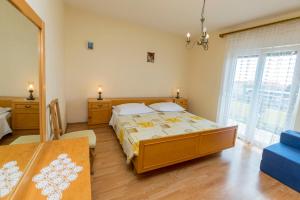 Postel nebo postele na pokoji v ubytování Apartment Lele