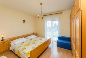 Postel nebo postele na pokoji v ubytování Apartment Lele