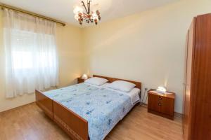 Postel nebo postele na pokoji v ubytování Apartment Lele