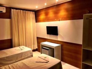 Un pat sau paturi într-o cameră la Hotel Terra do Sal