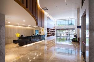 a lobby of a building with a library at Full Kind Hotel in Hualien City