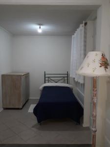 Säng eller sängar i ett rum på Chacara Recanto Vale do Luar