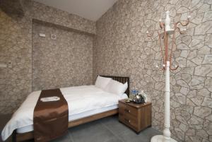 Ein Bett oder Betten in einem Zimmer der Unterkunft Yixiang Spring Travel