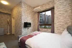 Ein Bett oder Betten in einem Zimmer der Unterkunft Yixiang Spring Travel