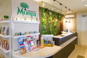 a mooza store with a counter in a store at Condominium Hotel Monpa in Chatan