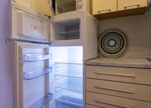 Kuchyň nebo kuchyňský kout v ubytování Apartmani ORION - Sunce